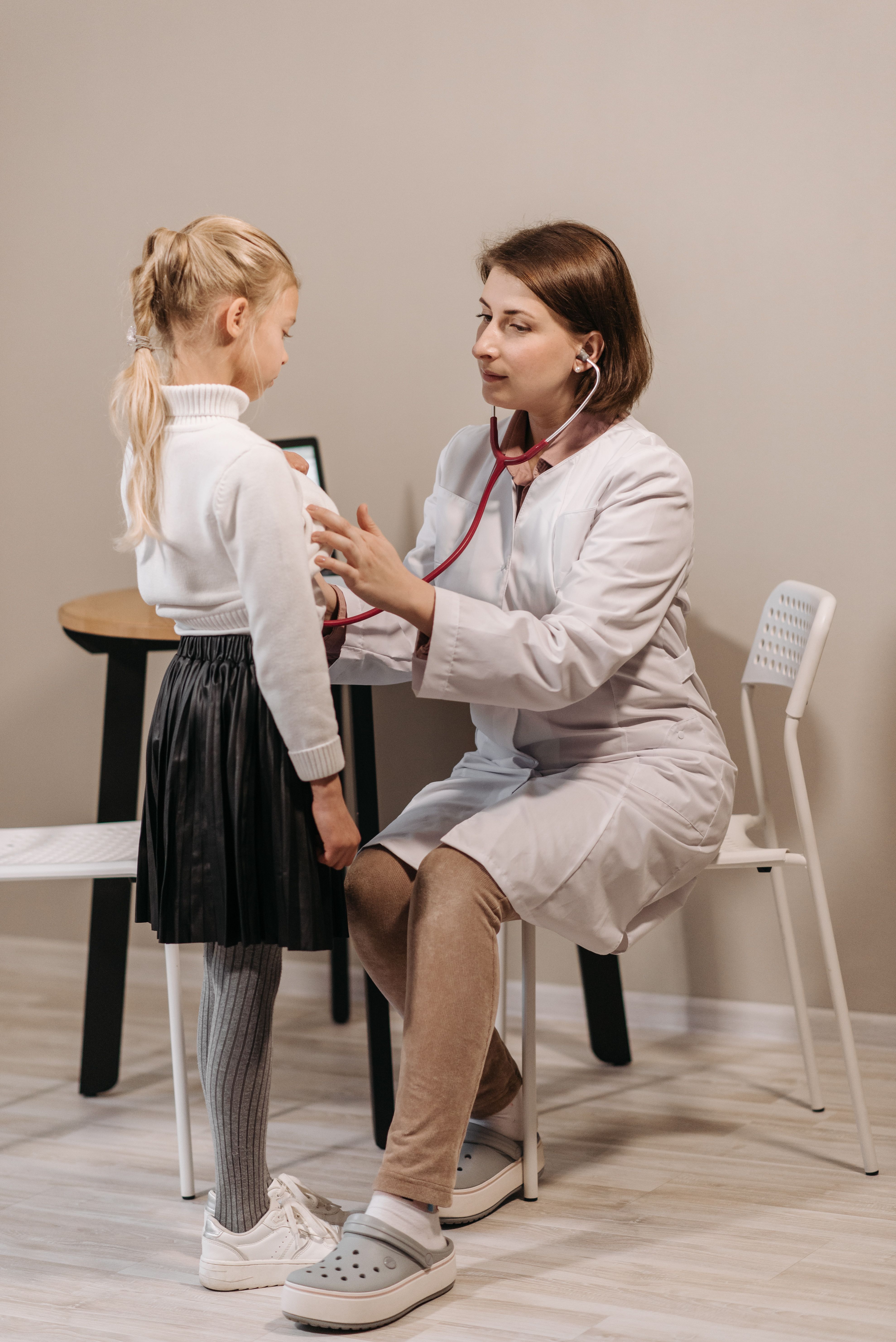 Therapist working with a child during a pediatric rehabilitation session